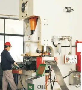 Friction disc stamping or forming equipment in operation